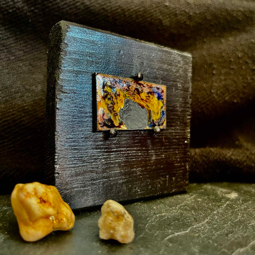 Fly Nest – original cloisonné enamel miniature on copper, side view on black frame with small stones from outside placed in the foreground. Handcrafted enamel art by A. Fraction.