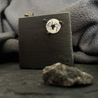 Spider enamel miniature on copper displayed on a handcrafted dark wood stand with stones as props