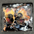 Baby Pigeons — vitreous enamel on copper miniature, 40 × 36 mm, fine silver cloisonné, kiln-fired. Warm amber, red and dark tones depicting two baby pigeons in a nest.  House Zoo series by A. Fraction, Vilnius.