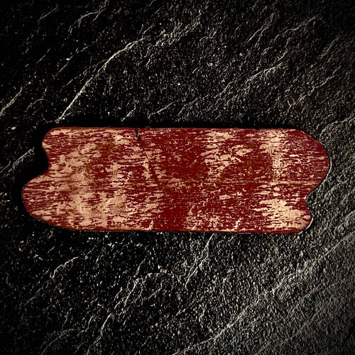 Reverse of a custom enamel commission showing bare copper with transparent contra enamel, organic irregular silhouette, by A. Fraction