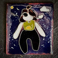The Wild Within, House Zoo — The Wild We Live With. Original cloisonné enamel on copper, close-up flat lay. A self-portrait figure floats against a deep navy sky with outstretched arms, a yellow moon, white cloud, and bird silhouette. 35 × 38 mm, A. Fraction.