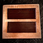 Reverse of Cloud enamel piece showing two dark magnet strips on bare copper, A. Fraction