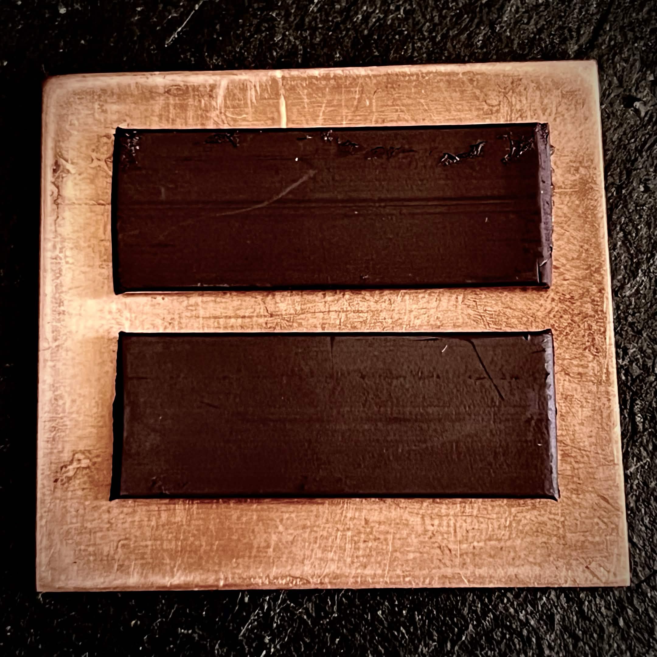 Reverse of Cloud enamel piece showing two dark magnet strips on bare copper, A. Fraction