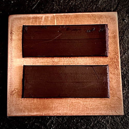 Reverse of Cloud enamel piece showing two dark magnet strips on bare copper, A. Fraction