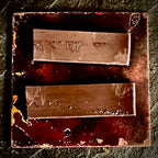 Reverse of Cow's Hairy Nose showing two magnet strips on dark enamel and copper back, A. Fraction