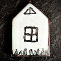 Little House — vitreous enamel on copper miniature, house-shaped, with painted window and grass detail, pale blue-white surface with copper border, 23 × 35 mm, by A. Fraction